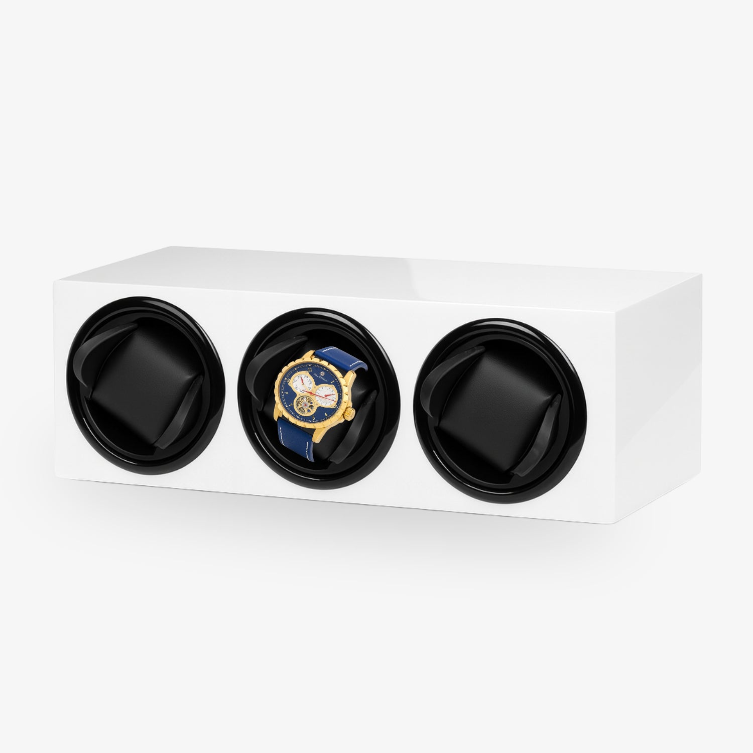 Weißer Uhrenbeweger mit drei Fächern, eines enthält eine goldene Armbanduhr mit blauem Armband und Zifferblatt.