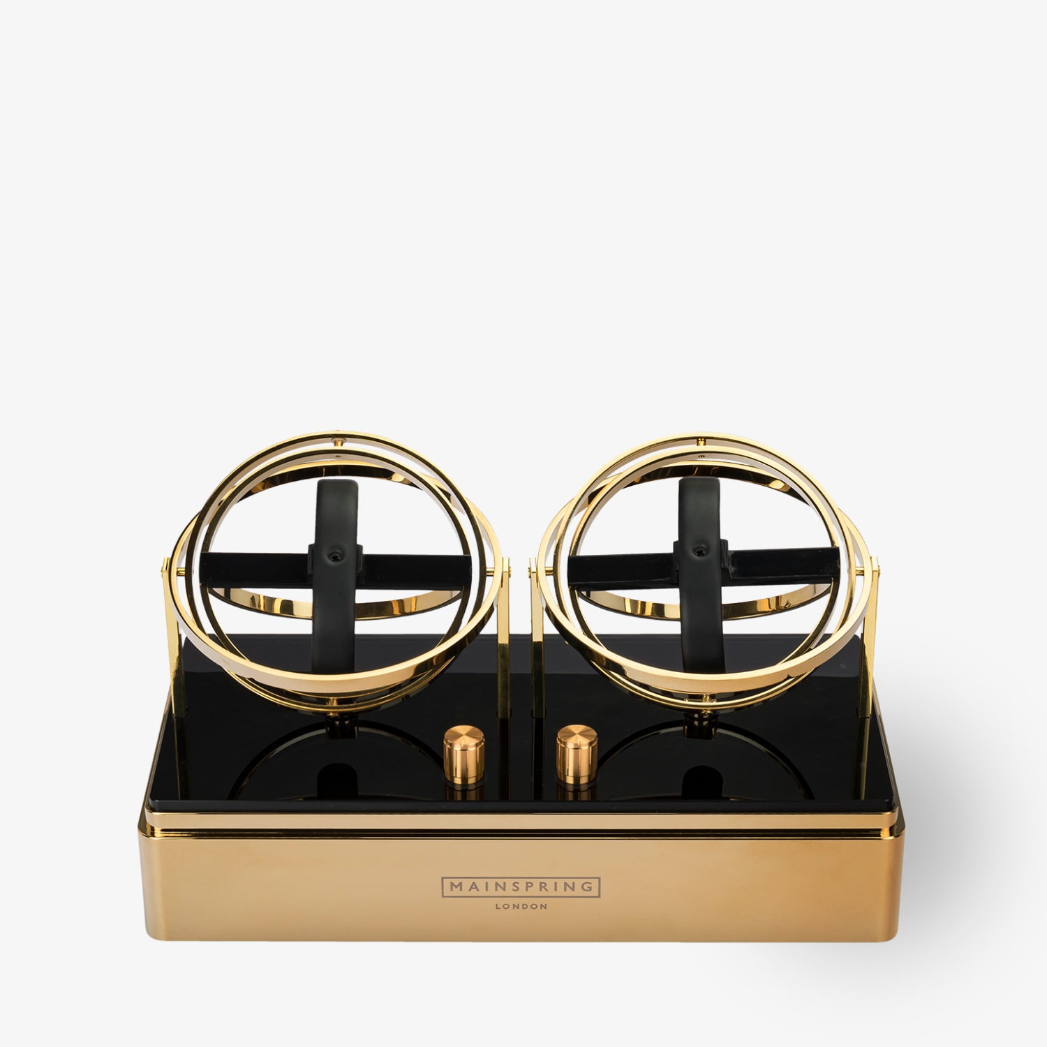 Goldener Uhrenbeweger mit zwei schwarzen Halterungen auf glänzender Basis, Marke Mainspring London.