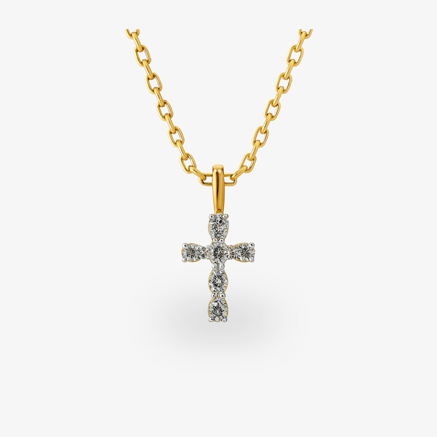 Goldene Kette mit einem mit Diamanten besetzten Kreuzanhänger vor weißem Hintergrund.