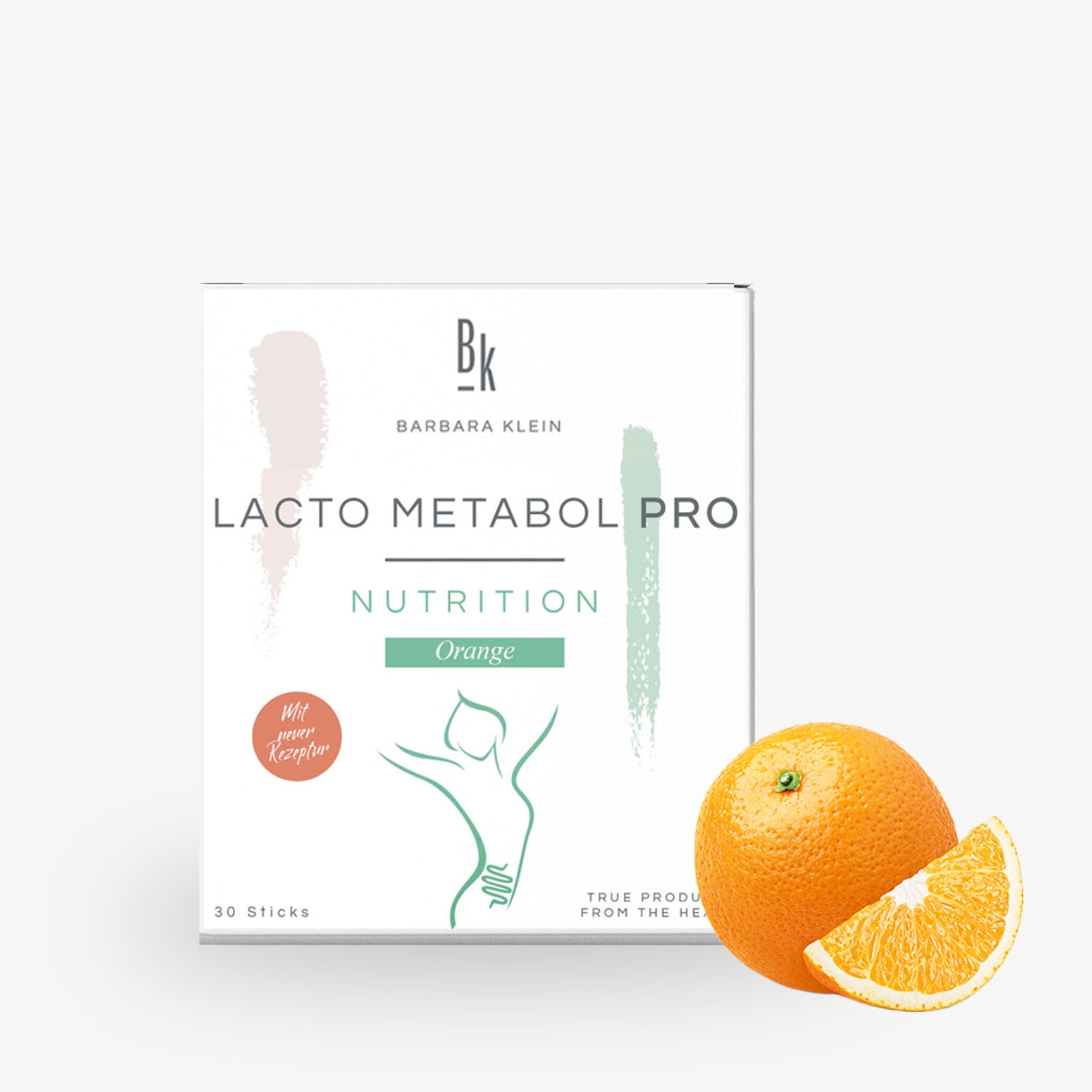 Eine Packung "Lacto Metabol Pro Nutrition, Orange" neben einer ganzen Orange und einem Orangenschnitz.