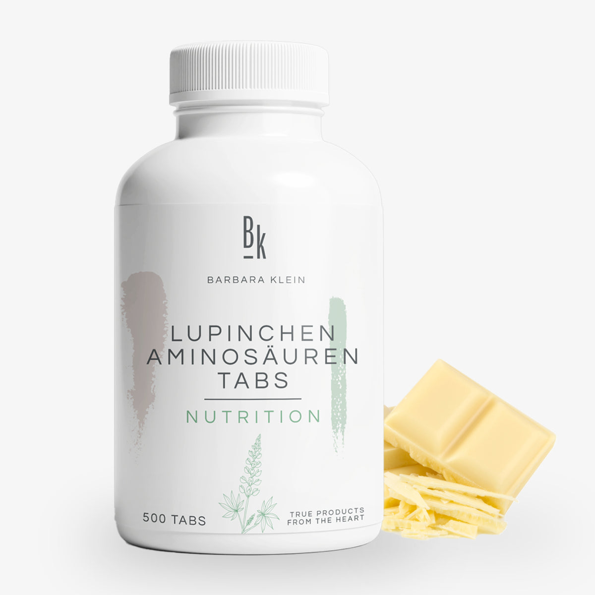 Eine Flasche Lupinchen Aminosäuren Tabs neben Stücken weißer Schokolade vor hellem Hintergrund.