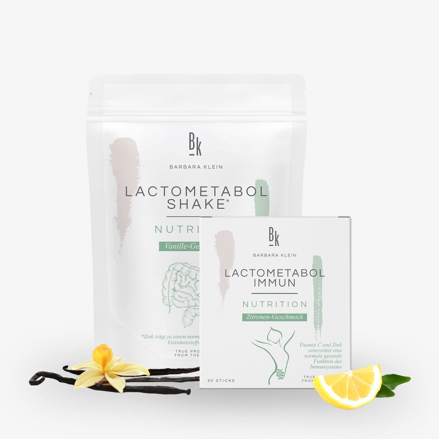 Lactometabol Shake und Immun von Barbara Klein, mit Vanille- und Zitronen-Geschmack, dekoriert mit Vanille und Zitrone.