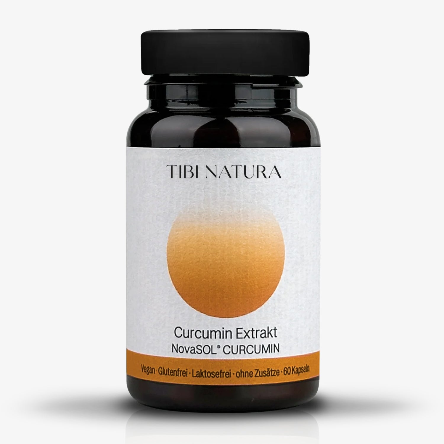 Eine schwarze Flasche mit Etikett von Tibi Natura, die Curcumin-Extrakt in 60 veganen Kapseln enthält.