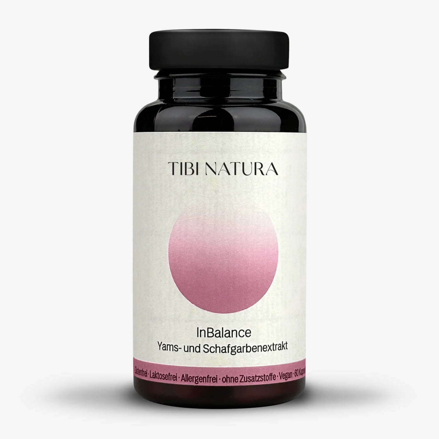 Schwarze Flasche mit pinkem Etikett und der Aufschrift "Tibi Natura InBalance Yams- und Schafgarbenextrakt".