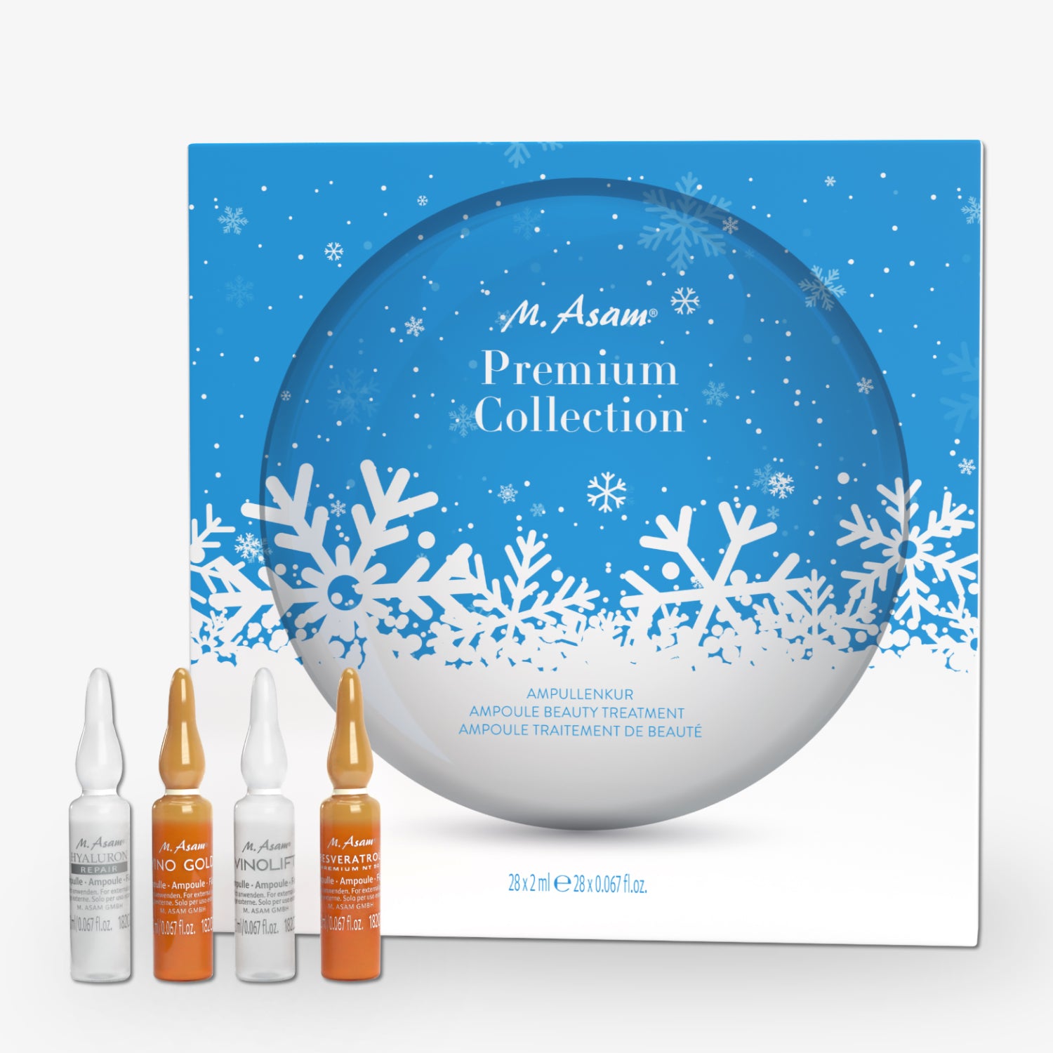 Blaue Verpackung mit Schnee-Design und vier Kosmetikampullen davor. Aufschrift: "M. Asam Premium Collection".