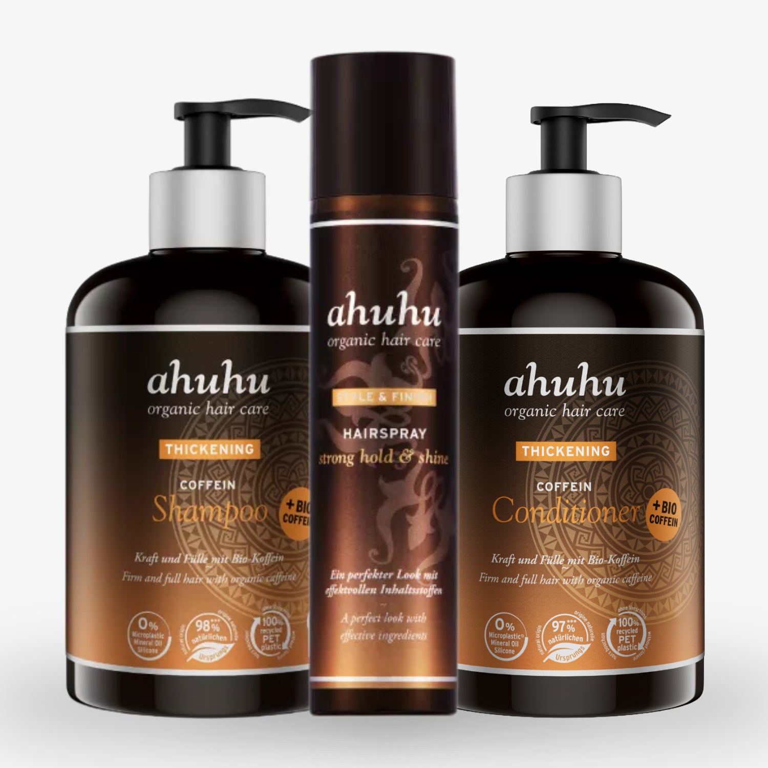 Drei Flaschen Ahuhu Organic Hair Care: Shampoo, Haarspray und Conditioner vor weißem Hintergrund.