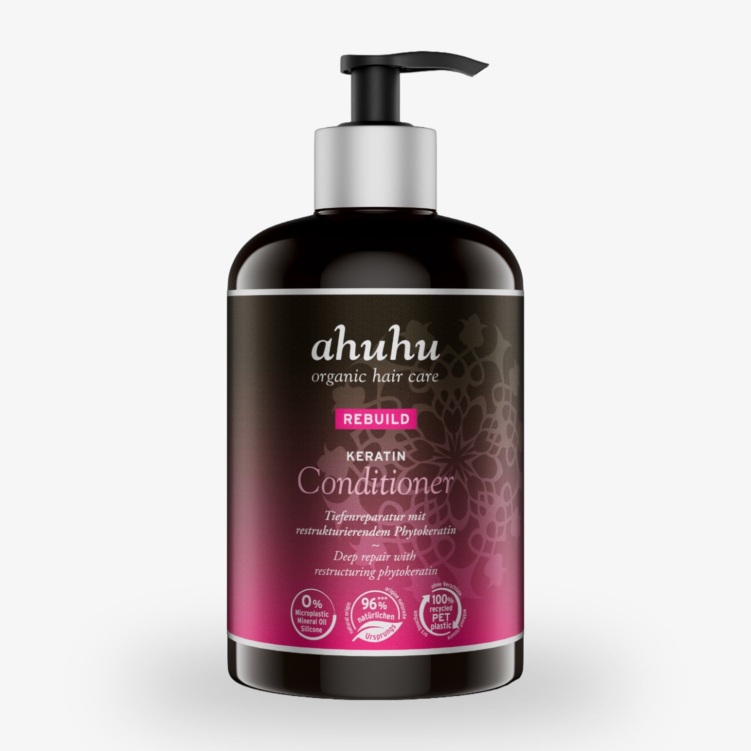 Eine Flasche ahuhu Keratin Conditioner mit Pumpspender, schwarzer Flasche und rosa Etikett, steht auf weißem Hintergrund.