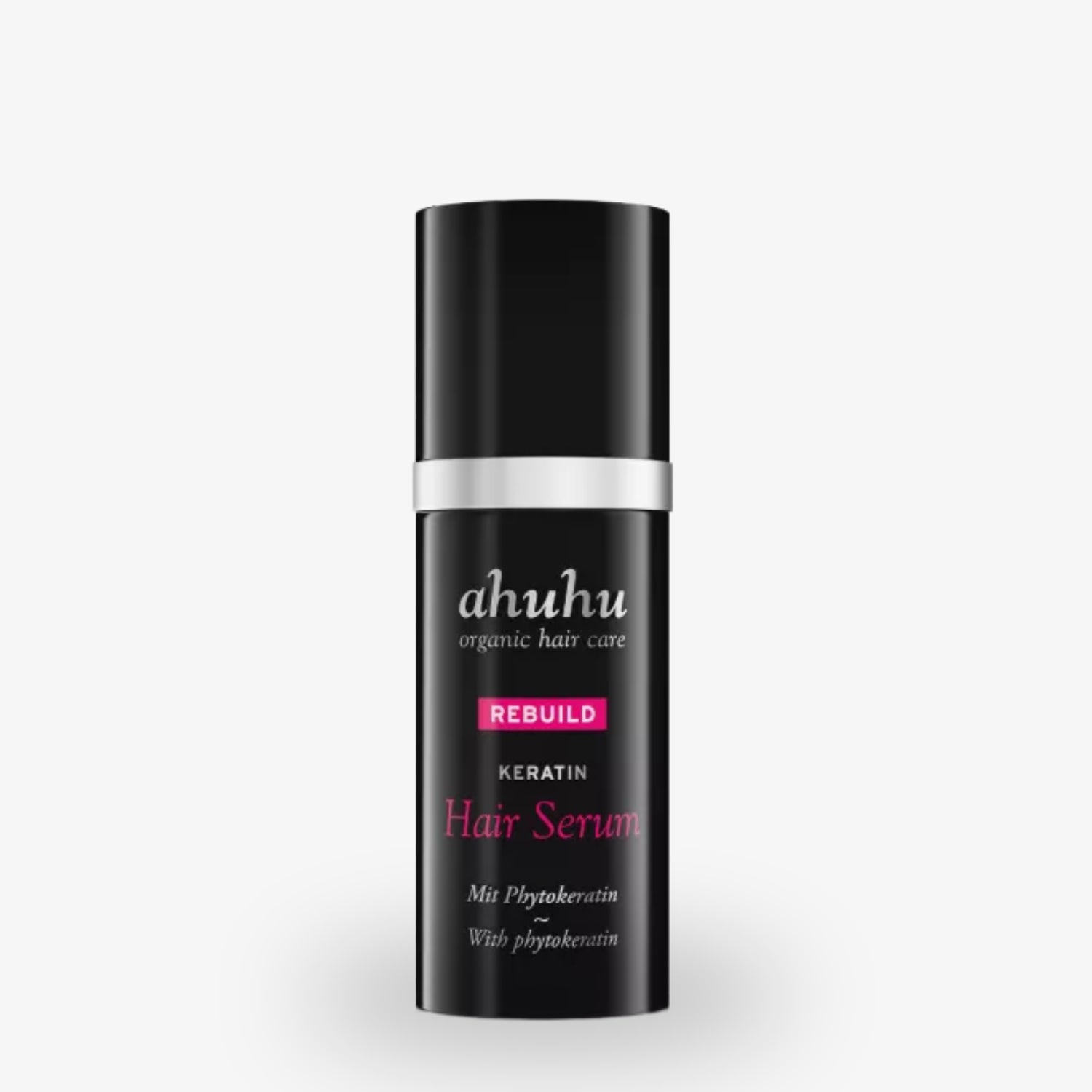 Schwarze Flasche eines Haarserums von Ahuhu mit der Aufschrift „Rebuild Keratin Hair Serum“.