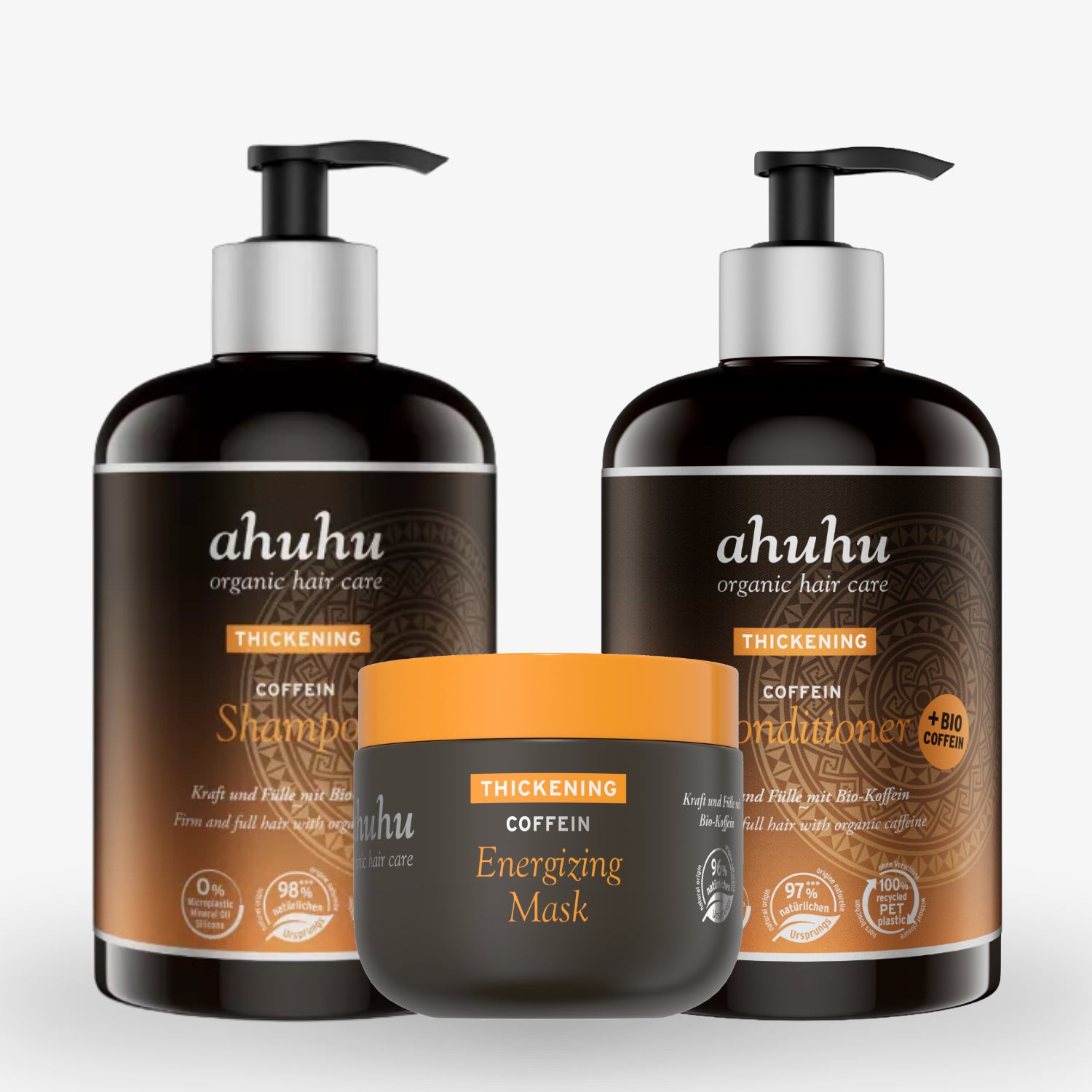 Drei Flaschen Ahuhu Haarpflegeprodukte mit Pumpverschluss, inklusive Shampoo, Conditioner und Energizing Mask.