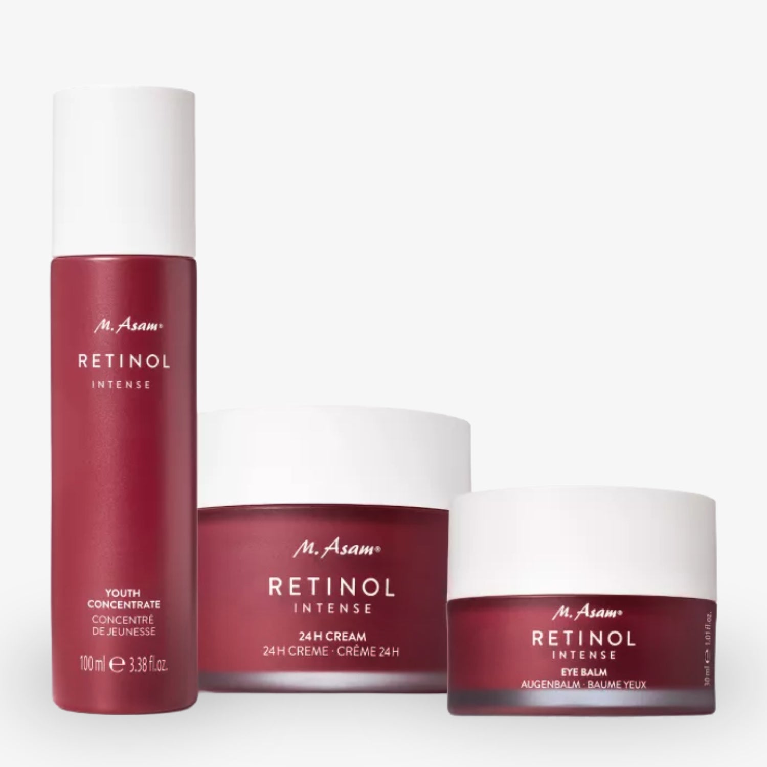 Drei rote Kosmetikprodukte von M. Asam: ein Retinol-Serum, eine 24h-Creme und ein Augenbalsam mit weißen Deckeln.