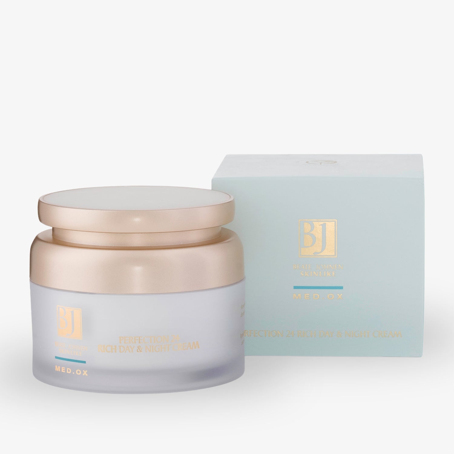 Goldene Creme-Dose neben einer blauen Verpackung mit der Aufschrift "BJ Perfection 24 Rich Day & Night Cream".