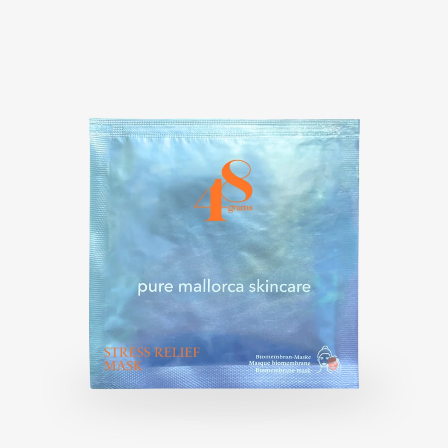 Verpackung einer Stress-Relief-Gesichtsmaske von "pure mallorca skincare" mit orangefarbenem Logo "48 grams".