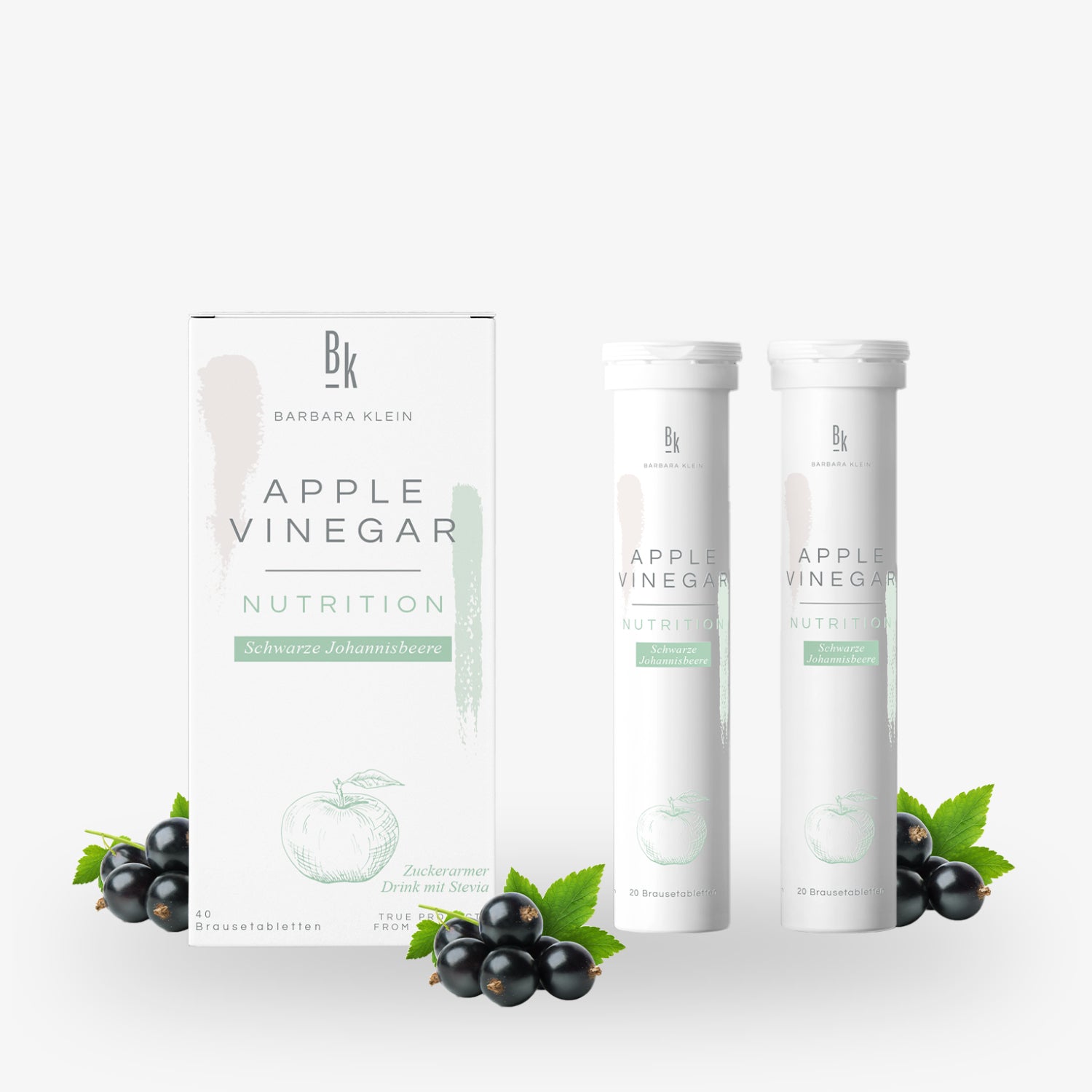 Verpackung und Röhren mit Apfelessig-Brausetabletten, Johannisbeeren und Blättern verziert.