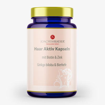 Blaues Flaschenetikett von "Haar Aktiv Kapseln" enthält Biotin, Zink, Ginkgo biloba und Bierhefe.