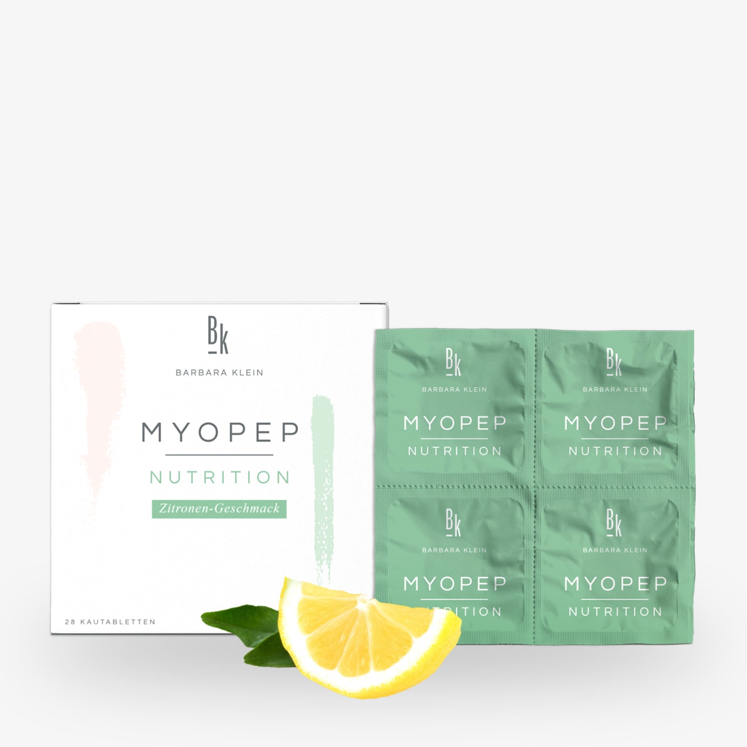 Verpackung von MyoPep Nutrition Zitronen-Geschmack mit Kautabletten, daneben eine Zitronenscheibe und Blätter.