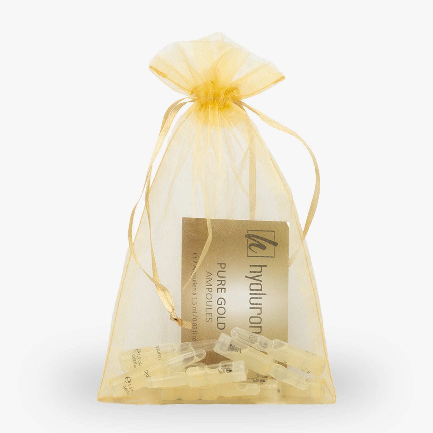 Goldener Organza-Beutel mit durchsichtigen Ampullen und einer goldenen Verpackung im Inneren.